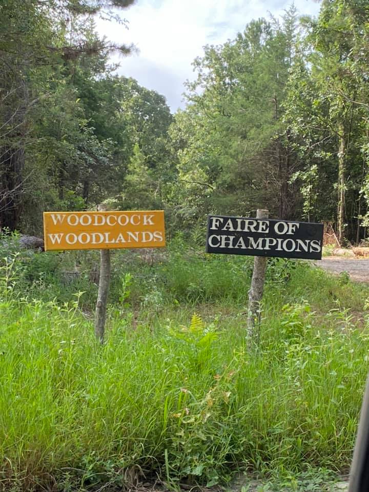 signs for Woodcock Woodlands and Faire of Champions